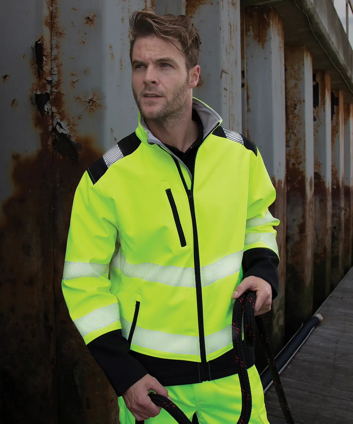 A man modelling a hi-vis softshell safety jacket